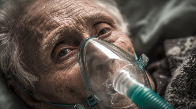 Elderly person oxygen mask hospital bed wrinkled skin close up illness healthcare sadness medical treatment senior patient