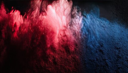 Fototapeta premium Abstract image featuring plumes of red and blue powder against a dark, textured background, creating an ethereal effect