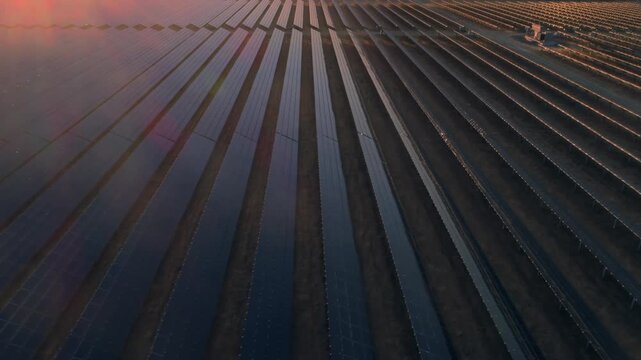 Aerial view of a vast solar panel farm in Santa Margarita, California, USA, at sunset. The panels generate clean, renewable energy, contributing to a sustainable future.
