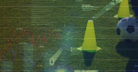 Showing yellow training cones and soccer ball resting on grass turf, with data overlay, copy space