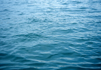 Fototapeta premium A simple and beautiful background of a calm blue water surface with gentle ripples creating a mesmerizing and abstract texture perfect for relaxation themes