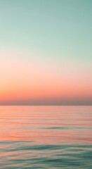 Obraz premium Pastel Ocean Sunrise - A Tranquil Seascape Wallpaper