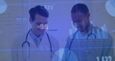 Two physicians wearing lab coats, stethoscopes reviewing data on tablet in clinic with data overlay