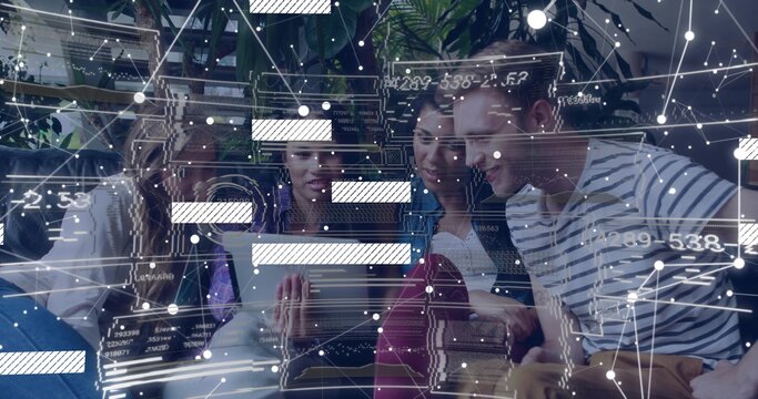 Collaborating team of four professionals analyzing tablet data in coworking lounge, with overlays