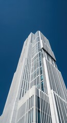 Obraz premium Contemporary White Skyscraper Architecture Against Blue Sky