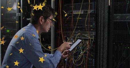 Diagnosing Korean technician kneeling at rack in data center, with tablet and multicolored cables