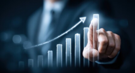 Businessman's hand interacts with a glowing upward bar graph in shades of blue suggesting growth and success