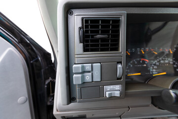 1990s full size American 4x4 SUV with 5.7L V8 interior dashboard and instrument cluster, showing analog gauges, odometer, climate controls, switches, and classic design details