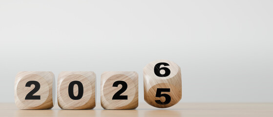 Wooden blocks showing number transition from 2025 to 2026 new year, change, and future planning concept.