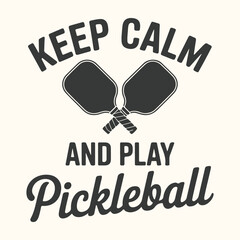 Vector art of keep calm and play pickleball graphic with two paddles and text