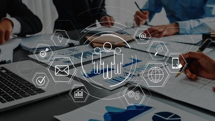 A business team engages in collaboration within a modern office, surrounded by digital interfaces and data visualizations, enhancing productivity and planning. Raster - Powered by Adobe