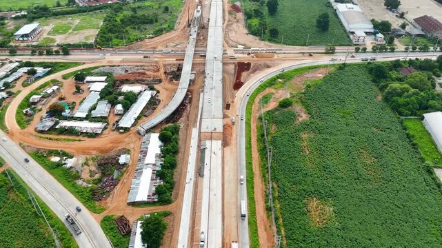 Aerial view drone footage of bridge construction being made across the intersection