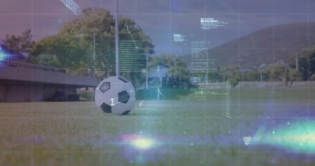 Sitting soccer ball on sports turf, with concrete bench and digital holographic code overlays