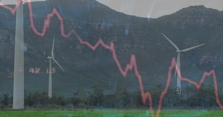 Displaying three white wind turbines rising from field at foothills, with red graph and label 42
