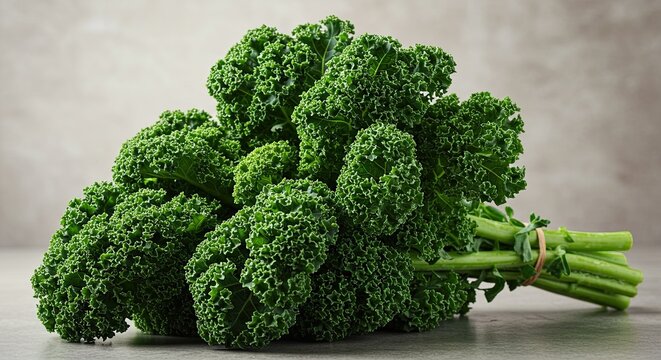 Fresh Green Curly Kale Bunch on Neutral Surface Close Up