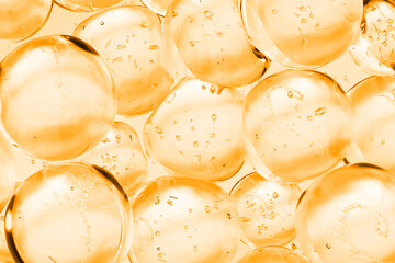 Oil cosmetic water gel texture with air bubbles in  orange background. Perfect for skincare, beauty products, serum ads, or medical and laboratory-related content. 