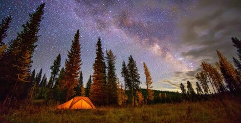 Glowing tent nestled in a forest clearing under a vast, star-studded night sky with a visible Milky Way arching overhead