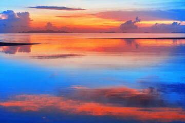 Sea beach sunset, calm ocean sunrise, beautiful peaceful tropical island landscape, idyllic...