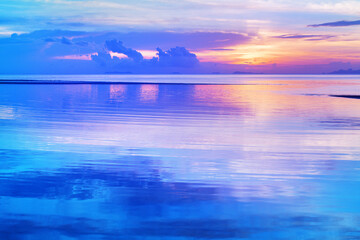 Sea beach sunrise, calm ocean sunset, beautiful peaceful dawn on tropical island, tranquil morning landscape, colorful pink purple sky, golden sun reflection on blue water, relax summer holidays, trav