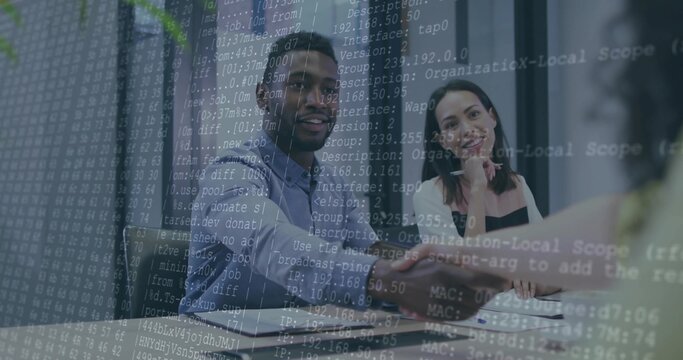 Man in blue shirt shaking hands in conference room, with laptop potted plant network code overlay