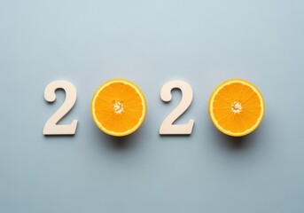 Vibrant 2020 New Year message with orange fruit