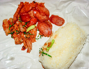 Thai Street Food Sticky Rice with Fried Pork and Sausage, Deep fried Pork with Sticky Rice.