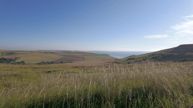 Cap Blanc-Nez, Escalles, Pas-de-Calais, Hauts-de-France, France, July 29th, 2025, The beautiful view of coastal hills and fields under a clear sky is perfect for nature lovers and adventurers