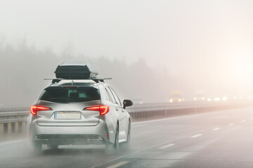 Road trip vehicle on wet slippery road