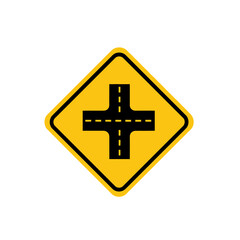 Obraz premium A yellow diamond-shaped traffic sign warning of an upcoming intersection with four roads.