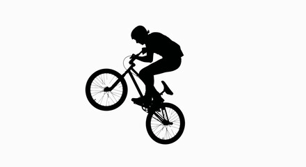 Fototapeta premium A silhouette of a bike rider doing stunts depicts freedom and daring challenges on two wheels