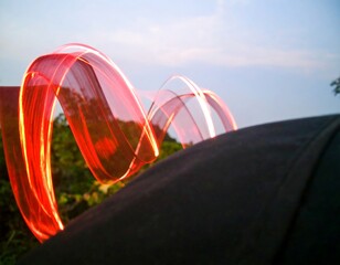 Red light trails against a dark background