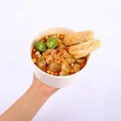 Traditional Fish Soup with Lime and Fried Fish Fillets in White Bowl on White Background