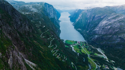 Breathtaking view of Lysefjord in Norway, showcasing steep cliffs and winding roads. winding curved road of Lysebotn 