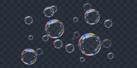 Realistic colorful soap bubbles on transparent background