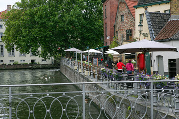Naklejka premium Riverside Cafe Terrace in Bruges Old Town