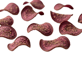 Extreme close-up of deep purplish-red root vegetable chips with unpeeled edges and black pepper flakes, scattered on a transparent studio background with soft natural light, emphasizing healthy snack