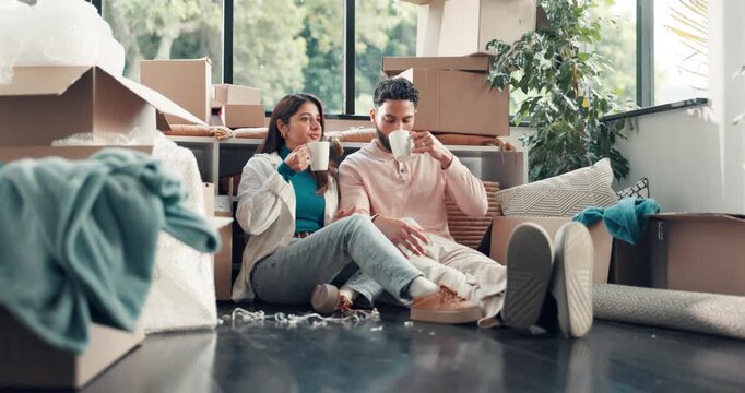 Coffee, relax and couple in new home with conversation, celebration or mortgage approval in property. Talking, people or financial investment in discussion with real estate and upgrade for relocation