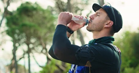Water, runner and man in nature for fitness, exercise and training for marathon outdoor. Sports, athlete and person with liquid, minerals and bottle for wellness, hydration and health for workout - Powered by Adobe