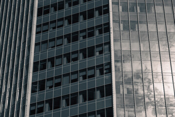 walls and empty windows of a modern building on a big city street without people