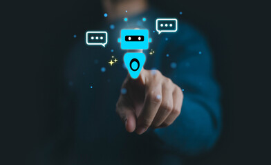 Futuristic concept of chatbot technology with artificial intelligence and digital communication, showing a human hand interacting with virtual robot assistant and speech bubbles.