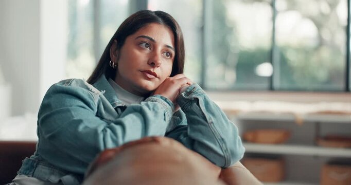 Woman, thinking or anxiety on sofa with stress, expecting news or answer for job application. Worry, unemployed person or frustrated in home with tension, financial strain or concern for career.