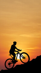 Silhouette cyclist conquer sunrise: A silhouetted cyclist conquers a steep incline against the fiery canvas of the setting sun.