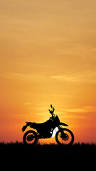 Motorcycle Silhouette at Sunset: A solitary motorcycle stands silhouetted against the vivid hues of a setting sun, painting a picture of adventure and freedom.