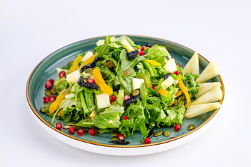 Plate of Fresh Vegetable Salad with Pomegranate Seeds and Cheese Cubes