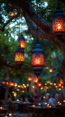 Glowing lanterns hanging from tree branches casting warm light wallpaper
