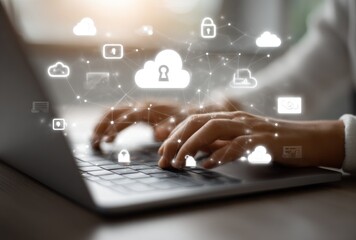 Abstract technology overlay on hands typing on a laptop keyboard, suggesting cloud computing and security