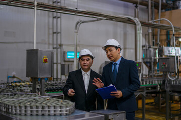 Employees are working at canned fish factory.
