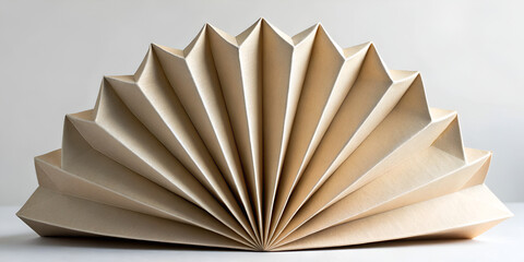 Abstract folded paper sculpture in beige tones styled in eco modern minimal decorative design
