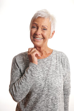 happy silver ager lady with short white hair and big smile