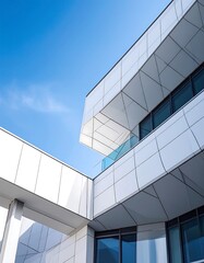 Modern architecture, white building, glass facade, against blue sky